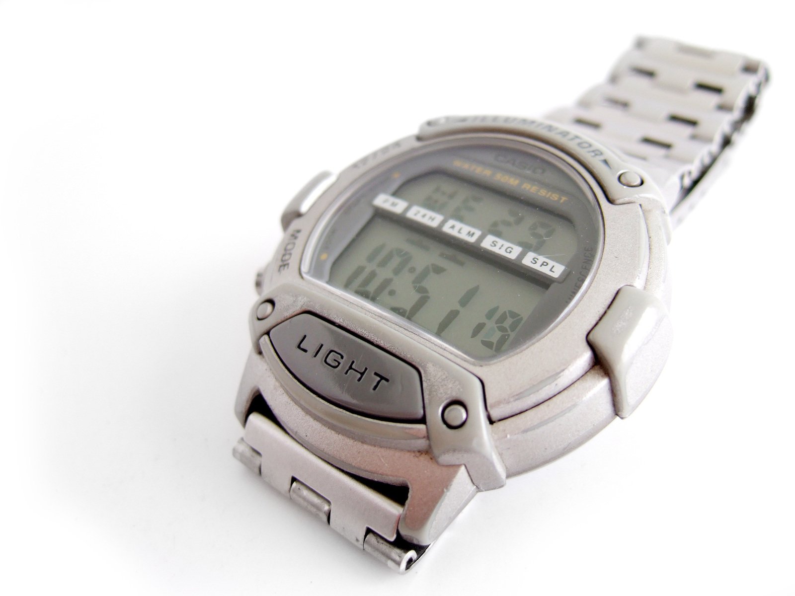 a watch with a silver case on a white background