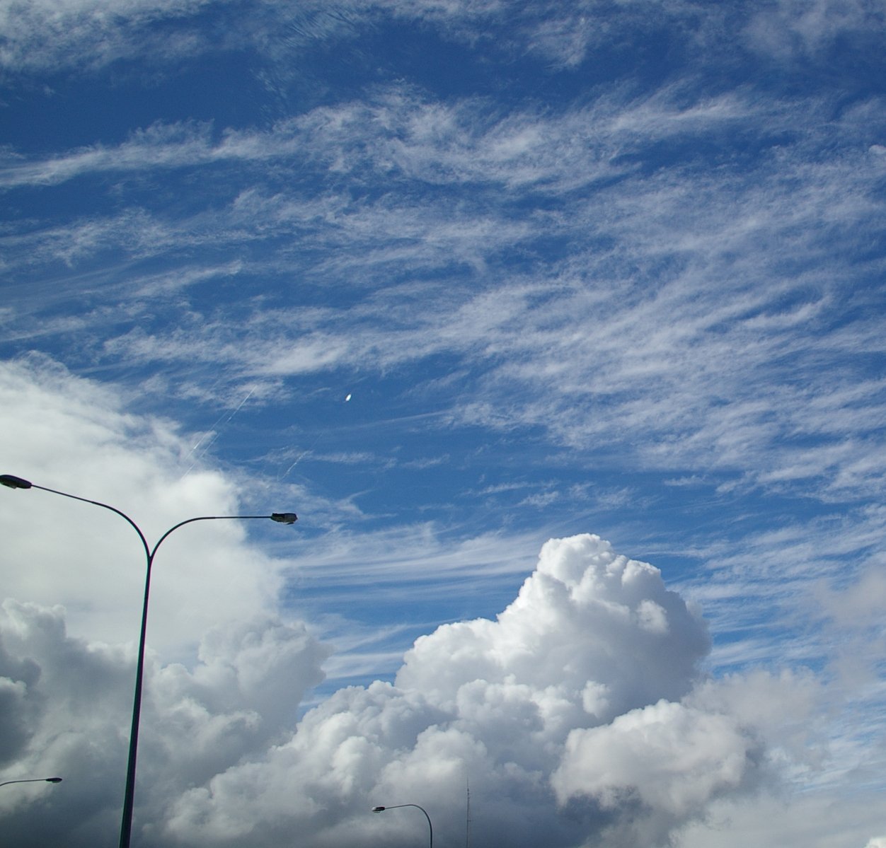 the time lapse image of clouds moving across a sky