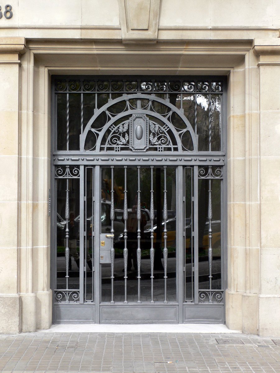 a black metal gate with ornate designs on it