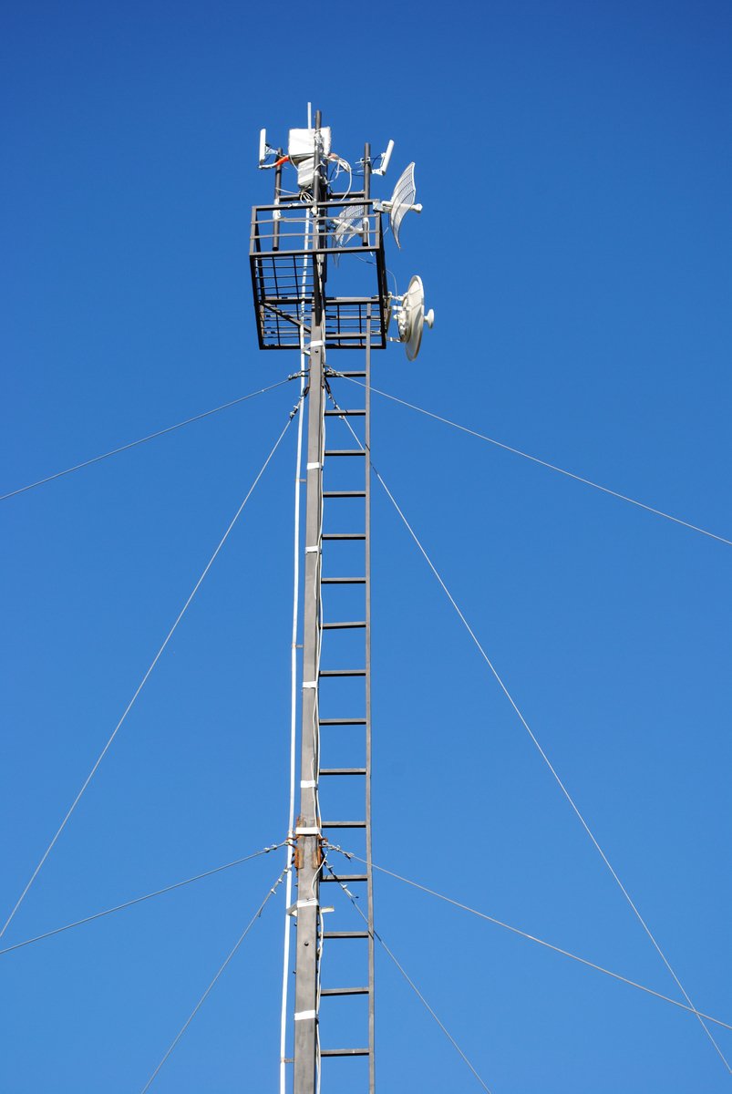 a small metal tower with some radio antennae on it