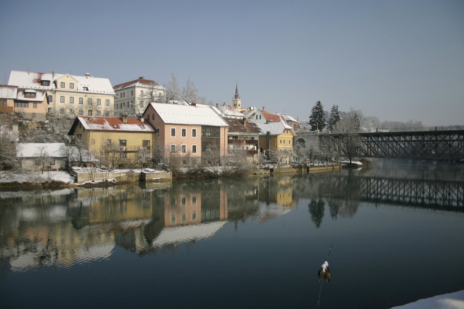 a winter scene with old town in the background