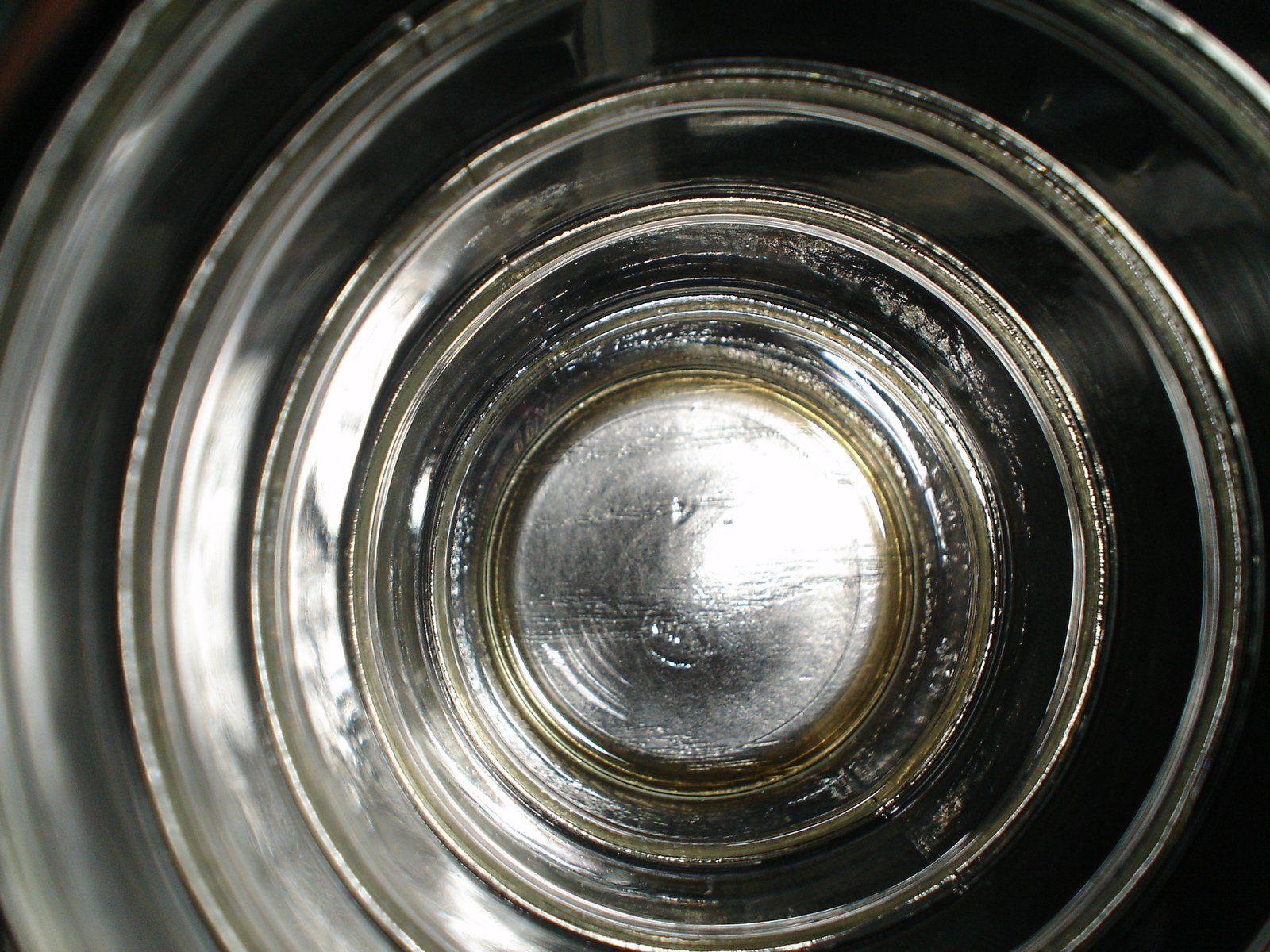 the top of a clear, empty glass bottle
