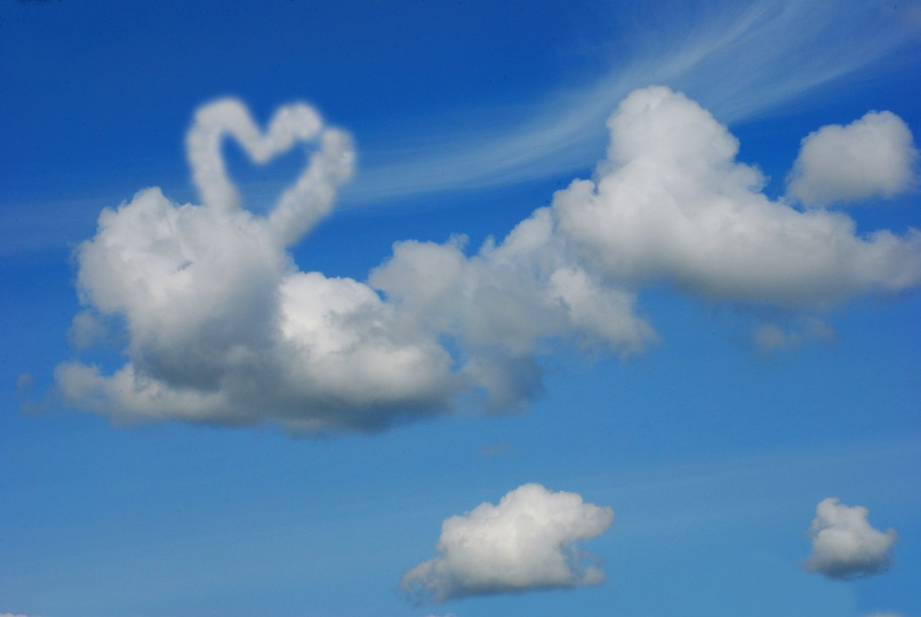 two white clouds with a sky background