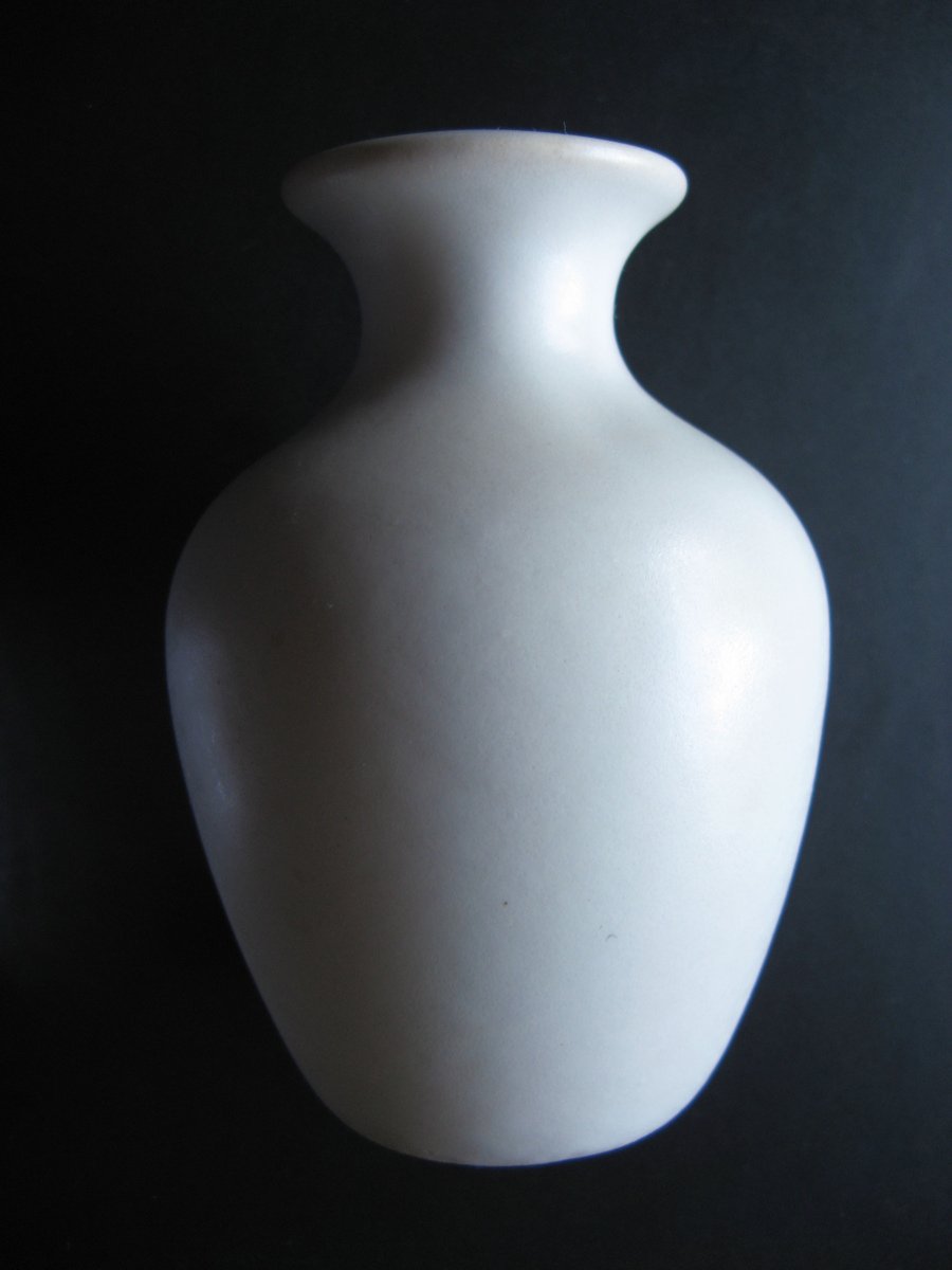 an artific vase on a black background