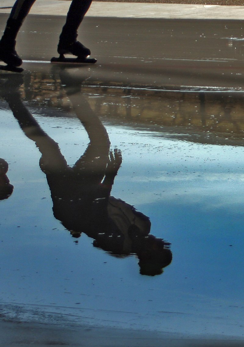 a person skating down a street near dles