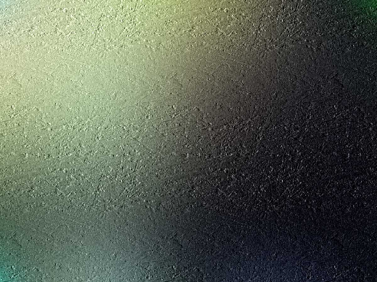 an abstract black background with blue and green highlights