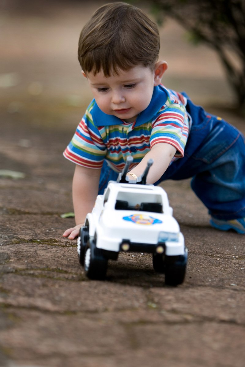 a small child playing with a toy truck