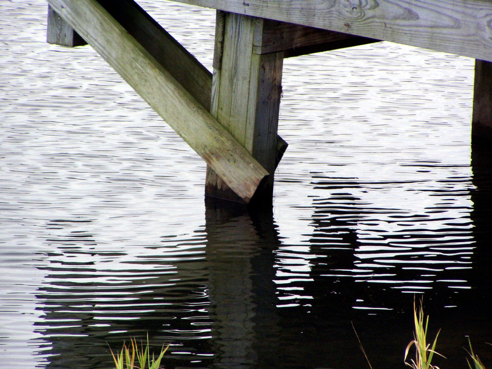 an old wooden dock is submerged in the water