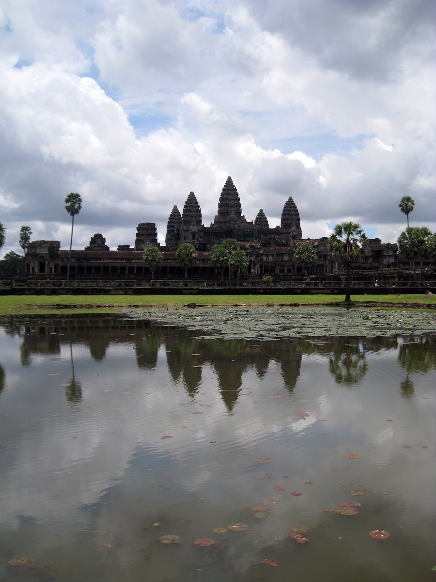 a very large body of water surrounded by stone temples