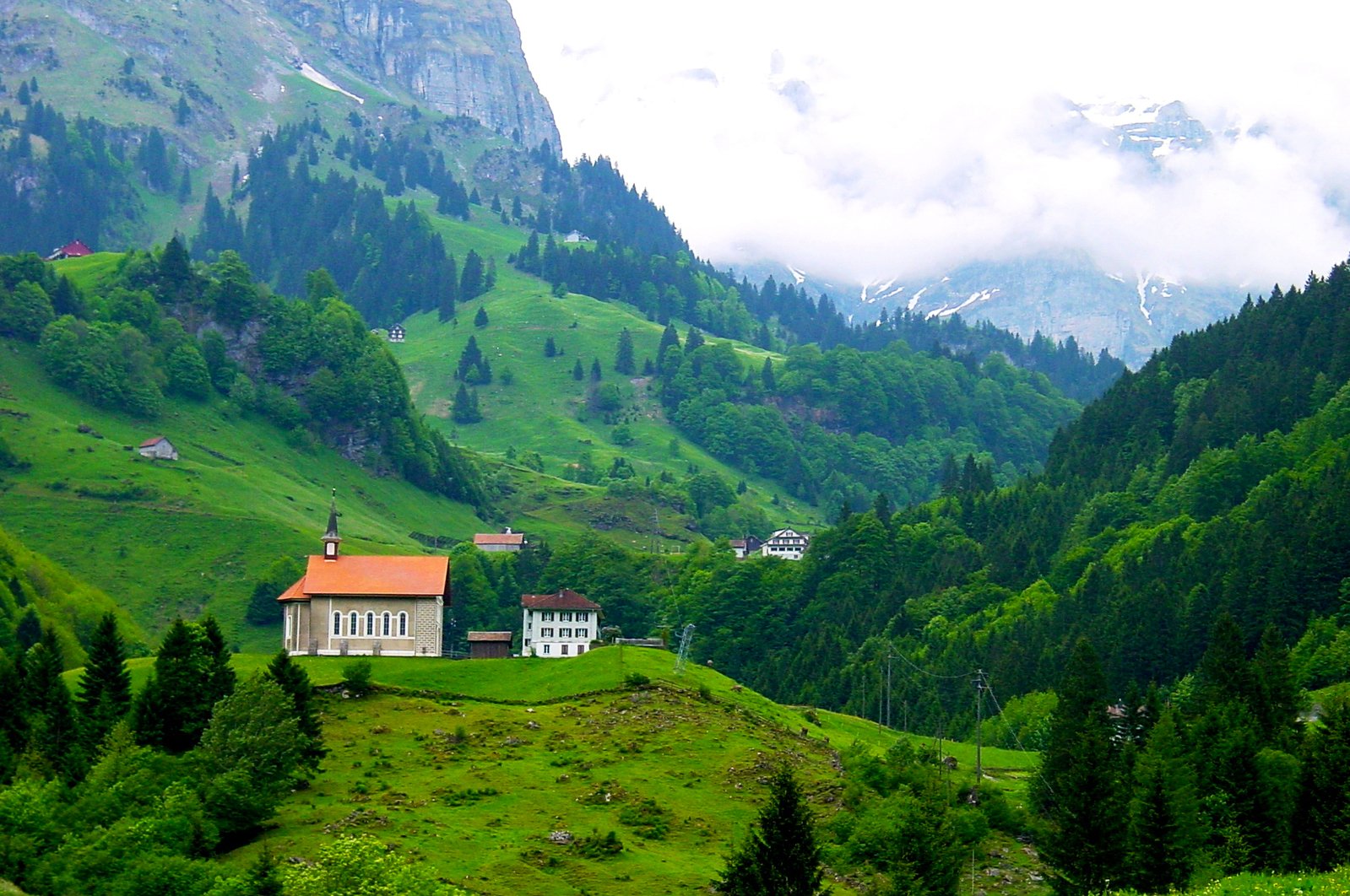 this is a cottage that sits on a mountain