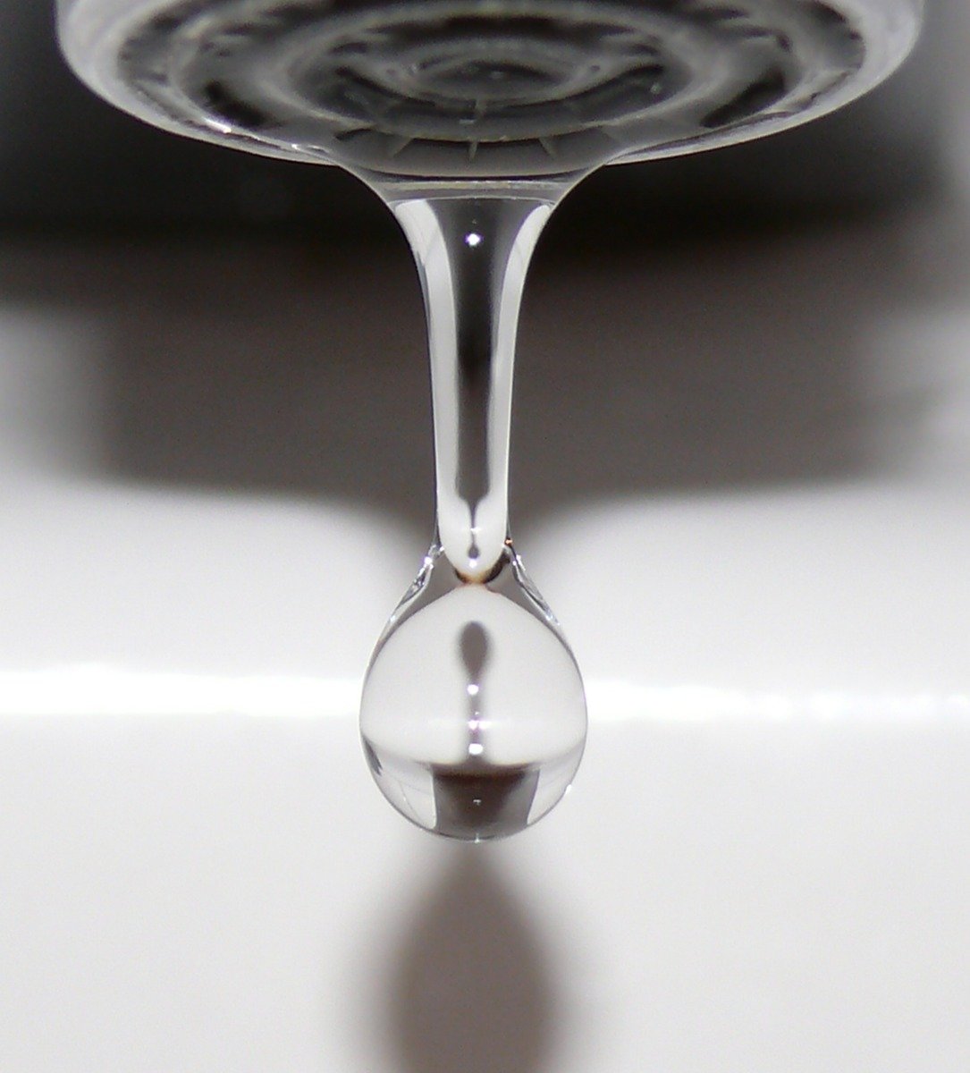 a water drop is seen from the bottom of a sink