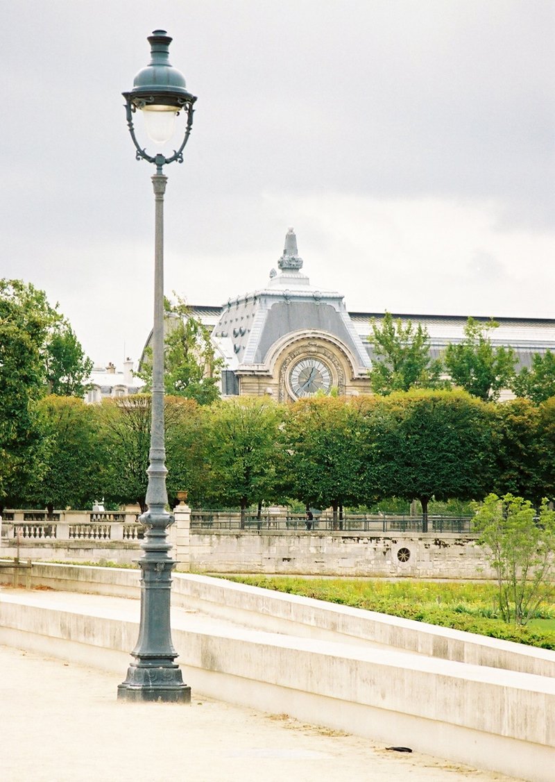 a lamp post and lamppost with street light on a city street