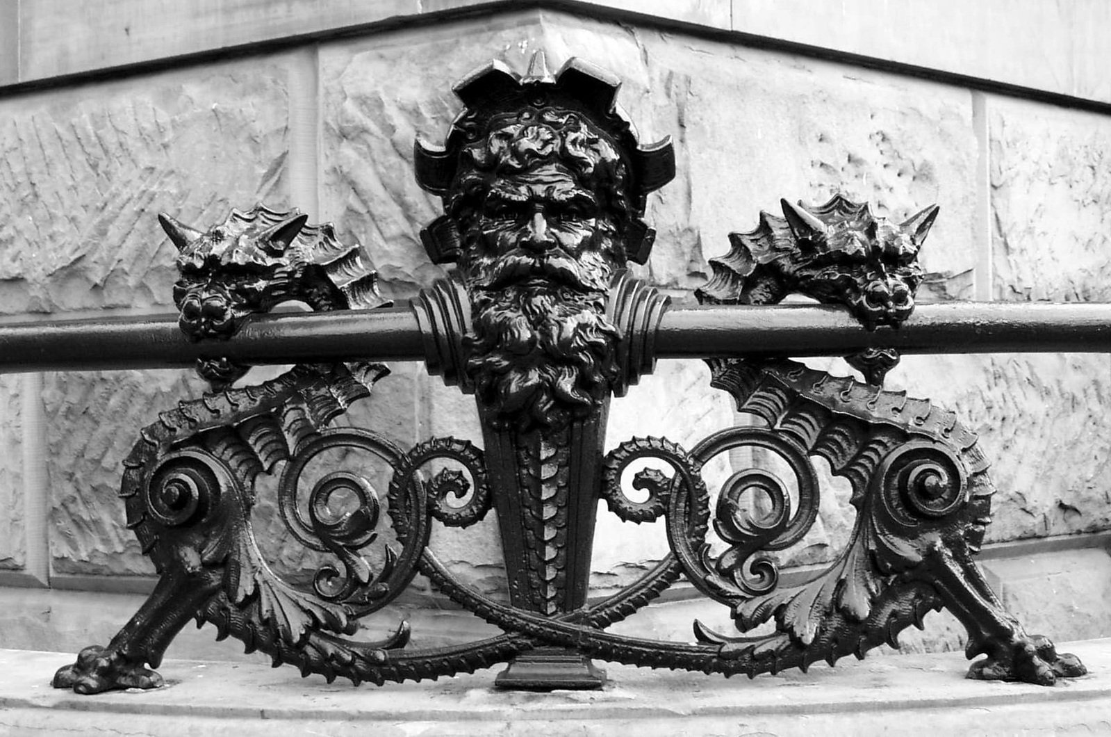 a black and white pograph of a wrought iron gate