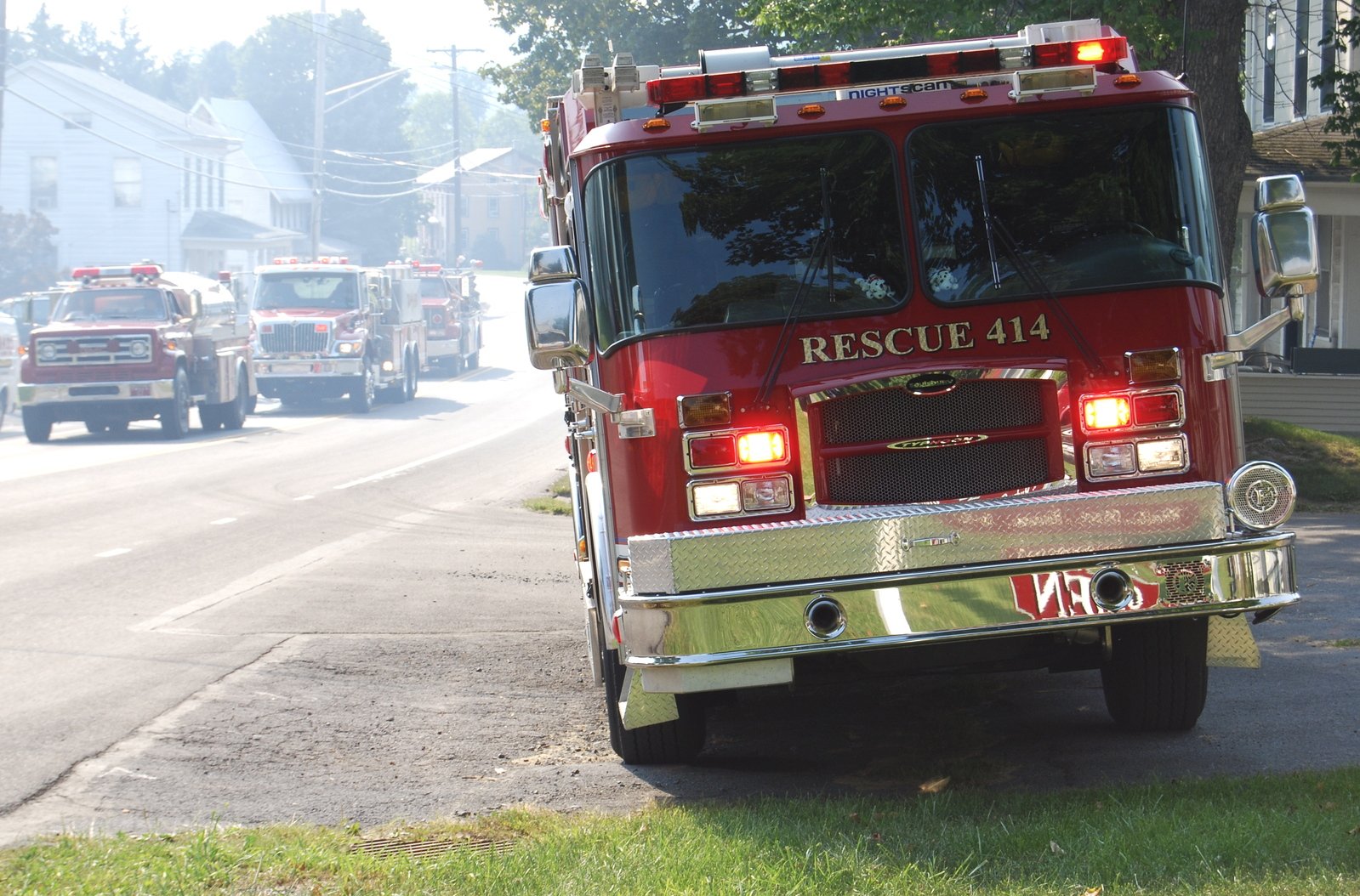 a red firetruck on a residential street