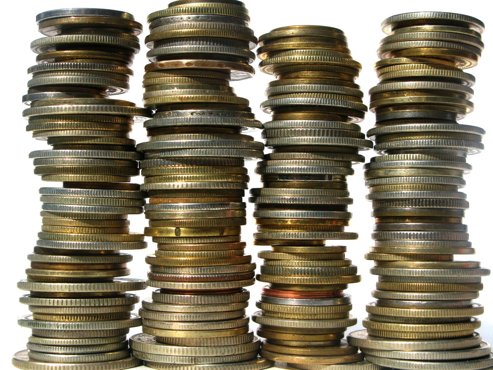 a pile of stacked stacks of coins against a white background