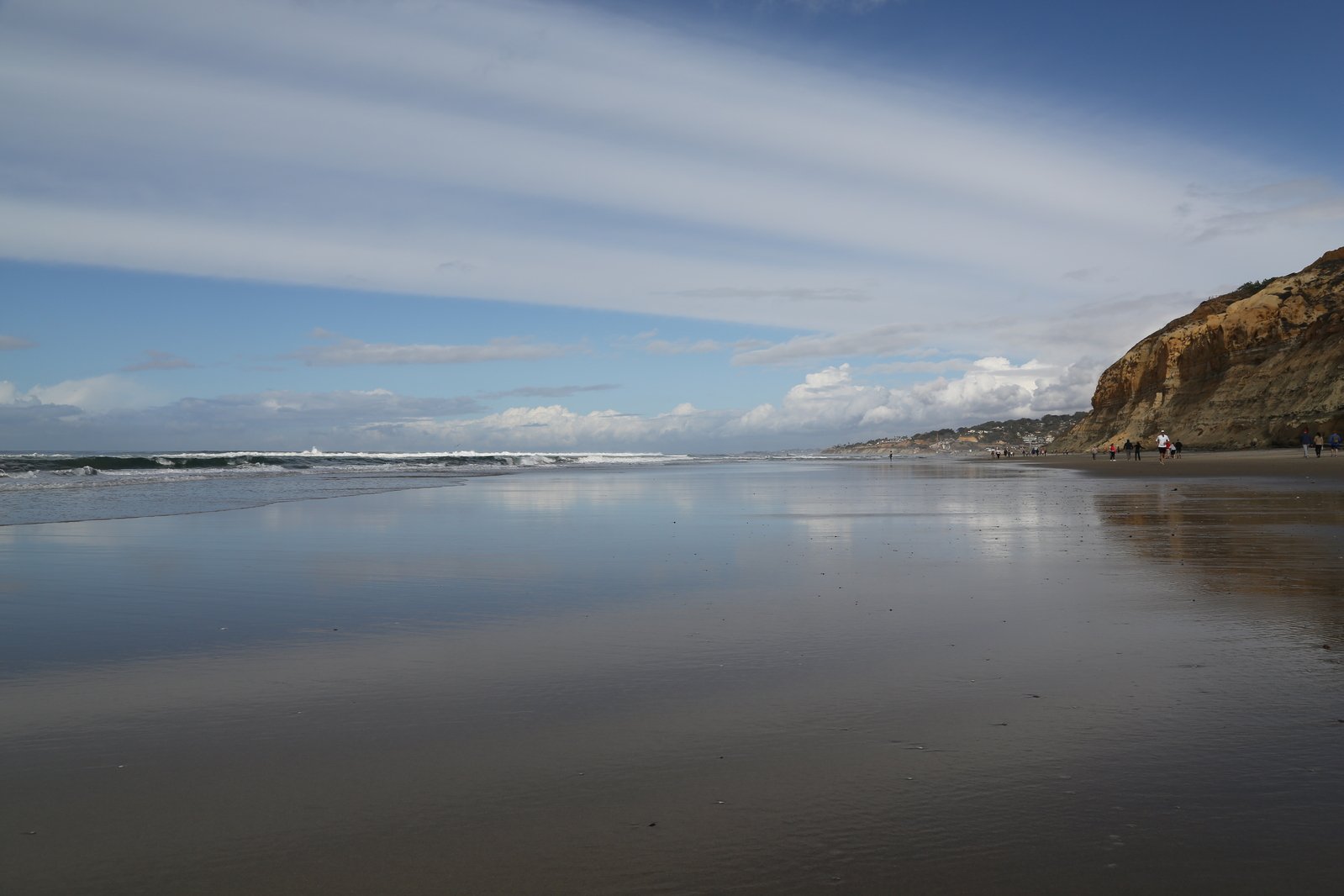 a beach is clean and empty under blue sky