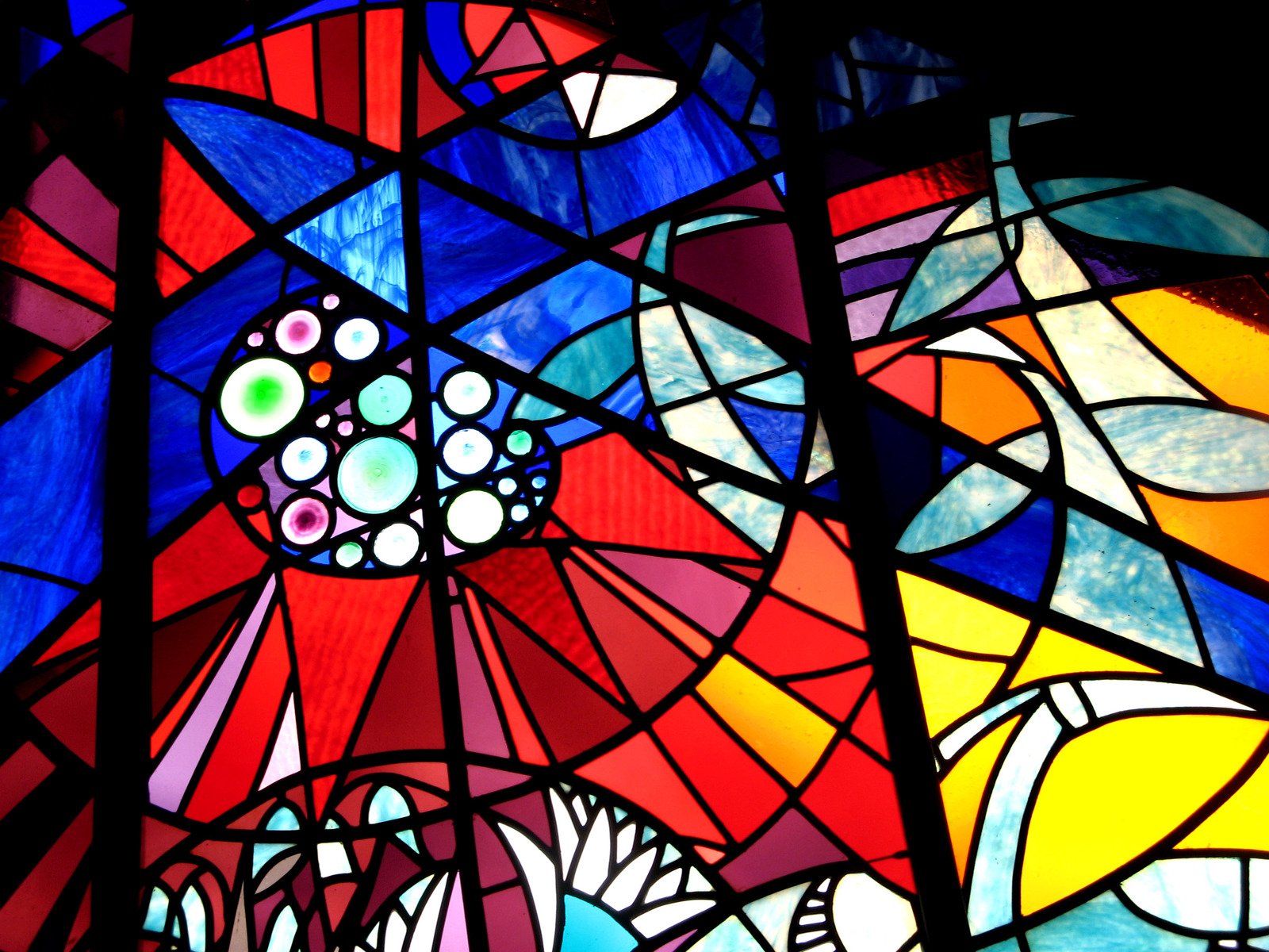a close up of a stained glass window in a building