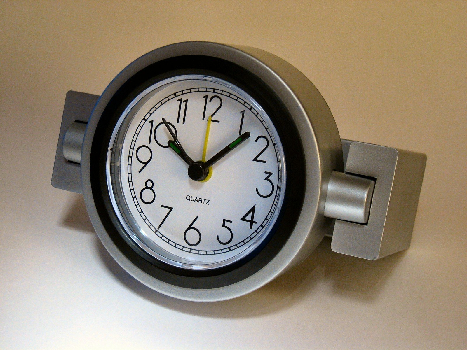 an analog clock mounted to the wall in the room