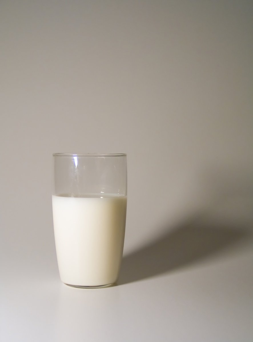 an empty glass with milk inside