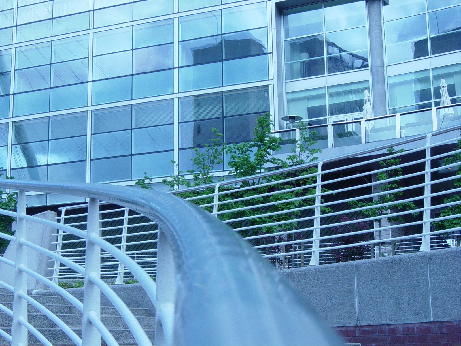 a water pipe and water flowing outside of a modern building
