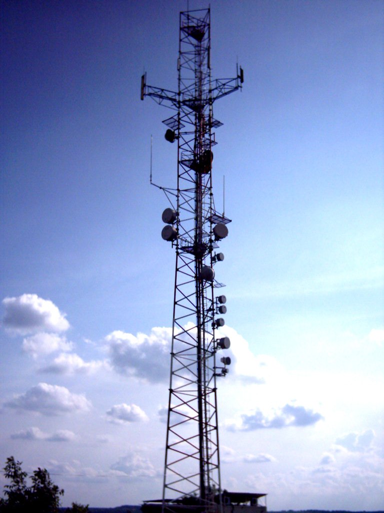 an old radio tower with several lights on top