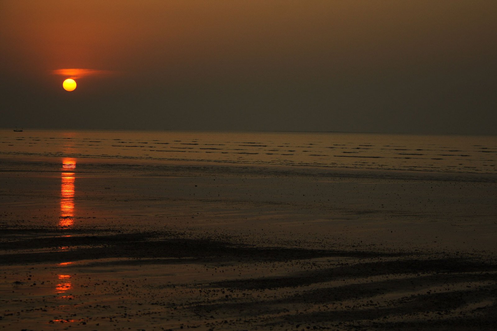 the sun setting over the ocean on the water