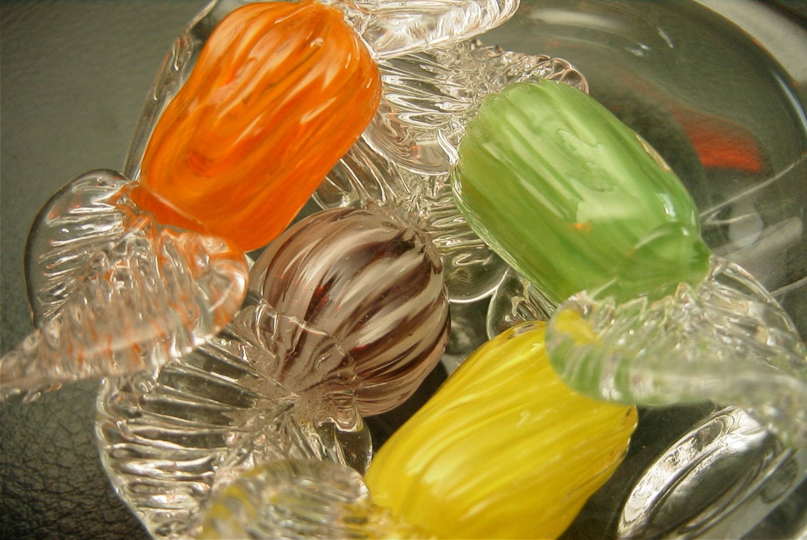 three candy rolls are arranged in an assortment