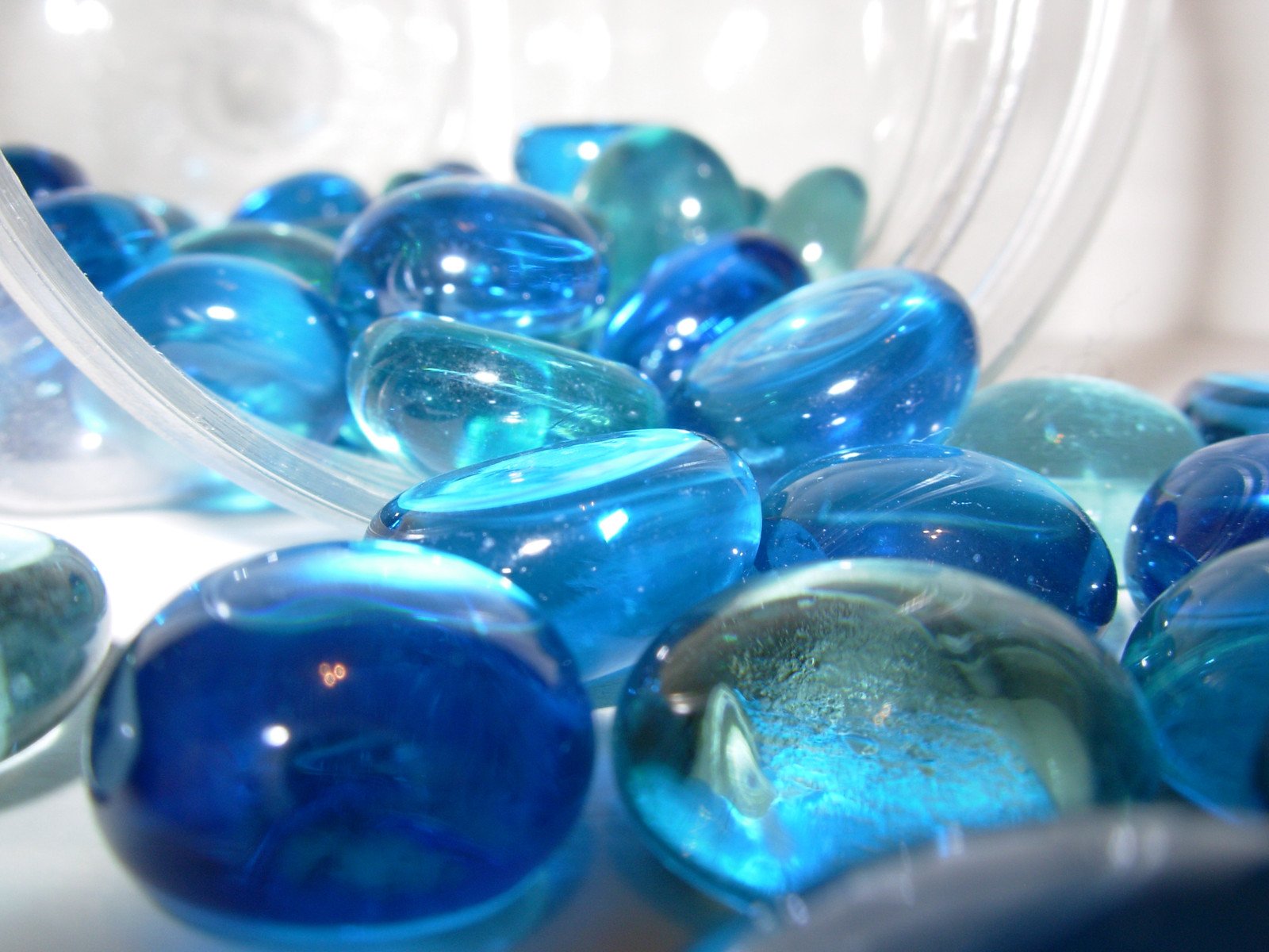 several pieces of glass marbles are shown in this picture