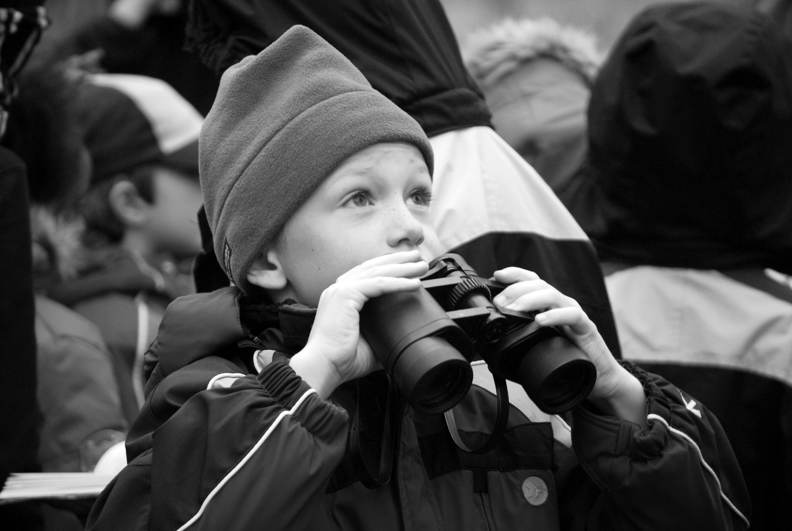 a  holding two cameras in his hands