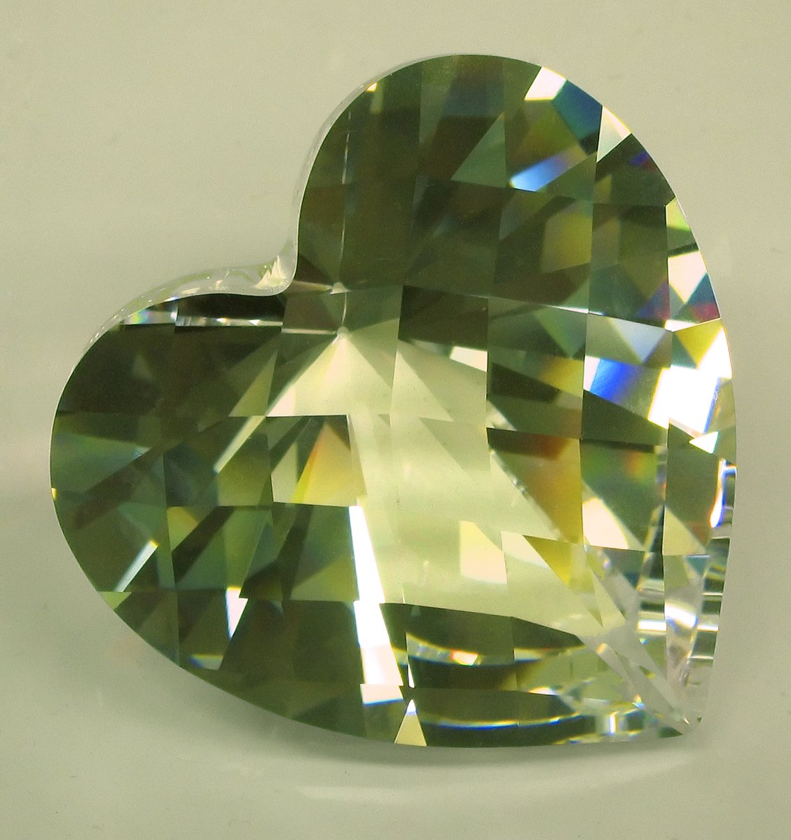 an green heart shape crystal stone