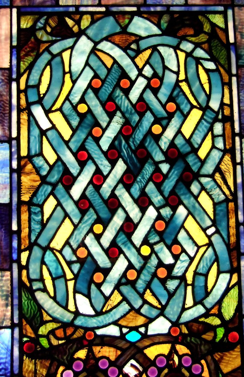 a close up of a colorful glass window