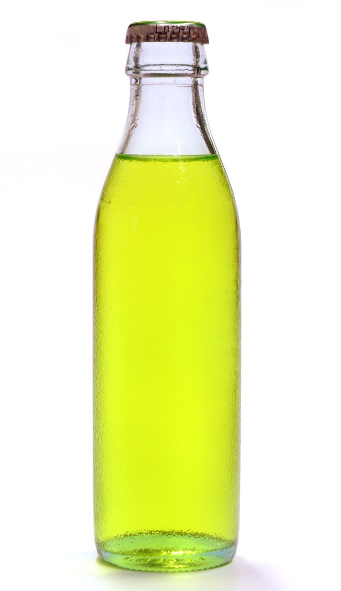 a green bottle with soing brown in it