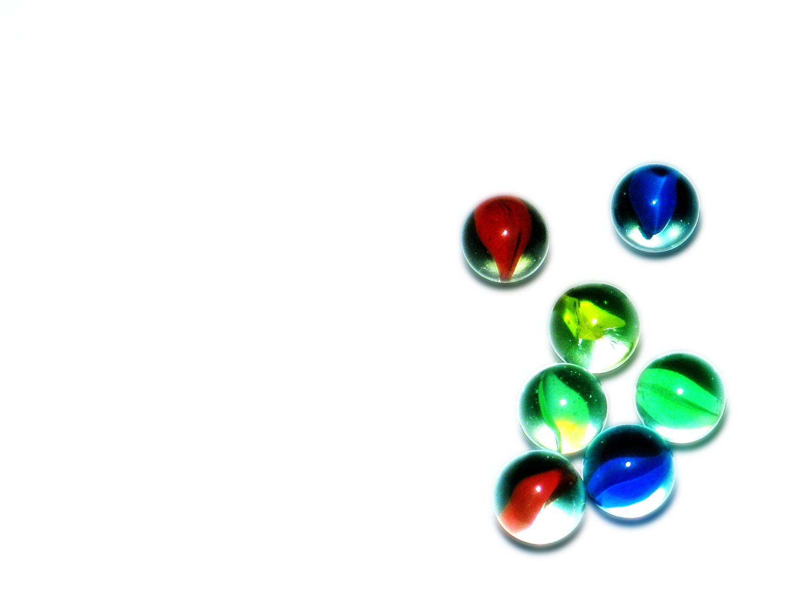 several circular glass beads laying on the floor