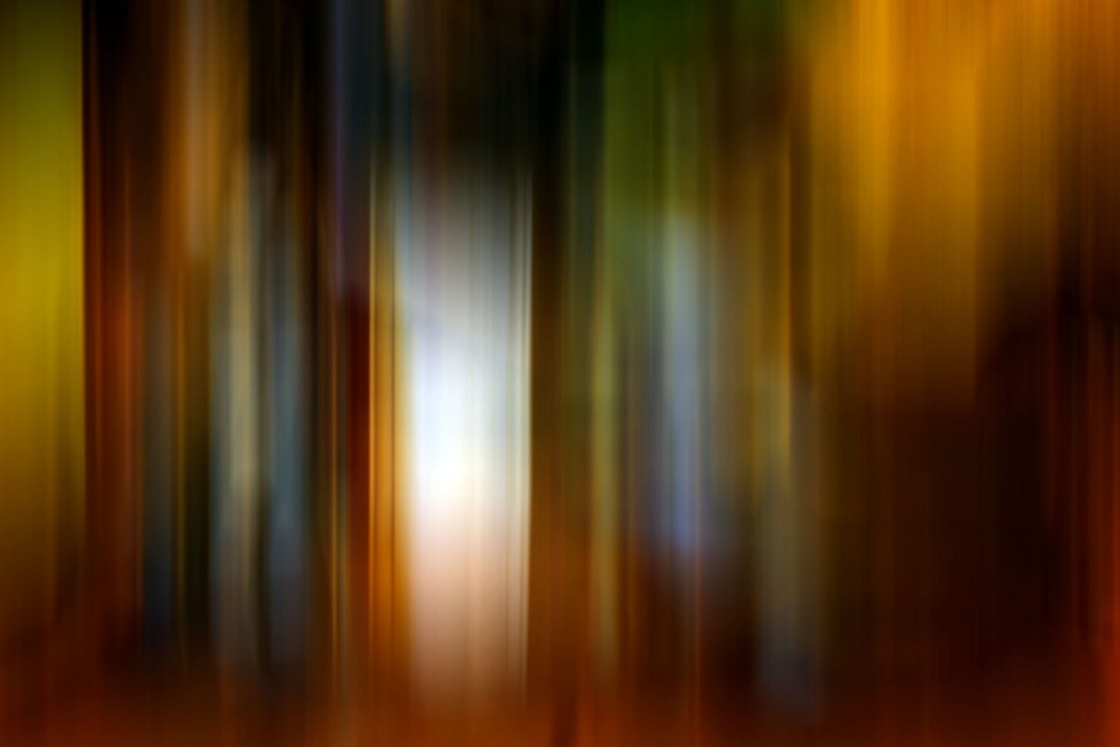 blurred image of a green and yellow forest
