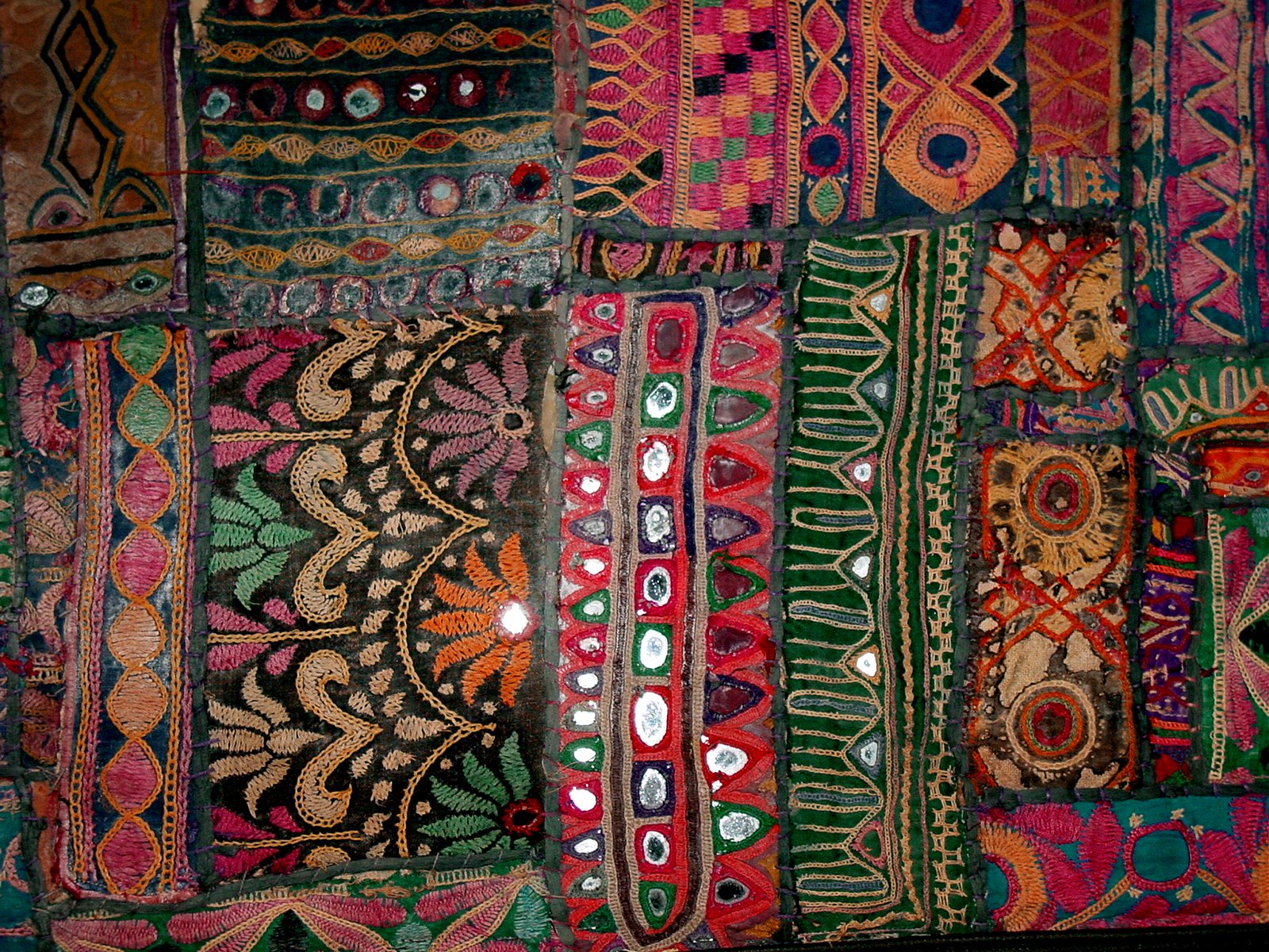 a group of different colorful fabric with lots of different designs