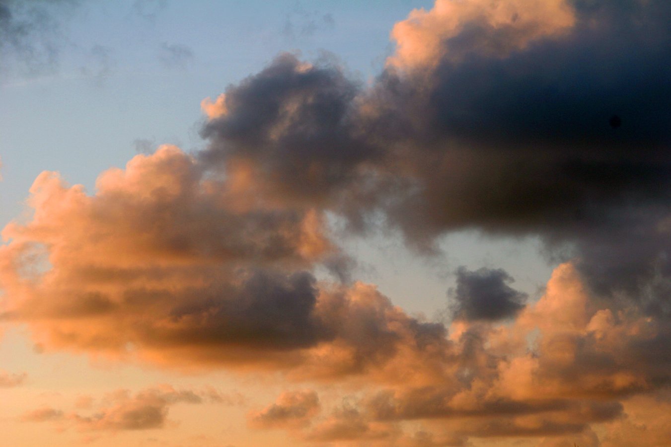 the clouds are shining on a blue sky with no clouds