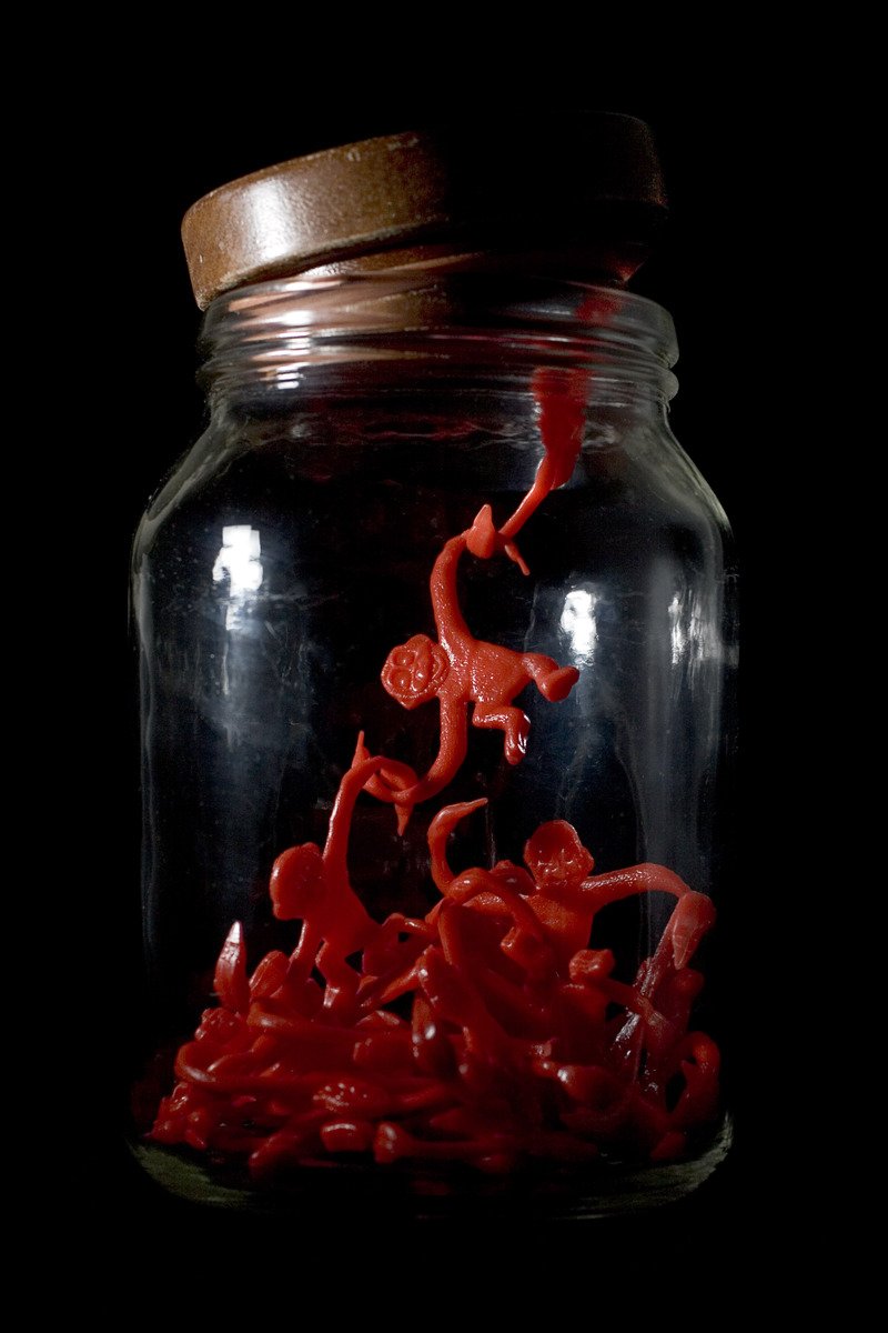 a jar filled with red gummy bears
