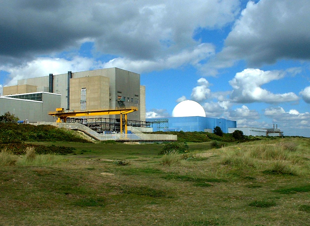 a field is shown with a building behind it