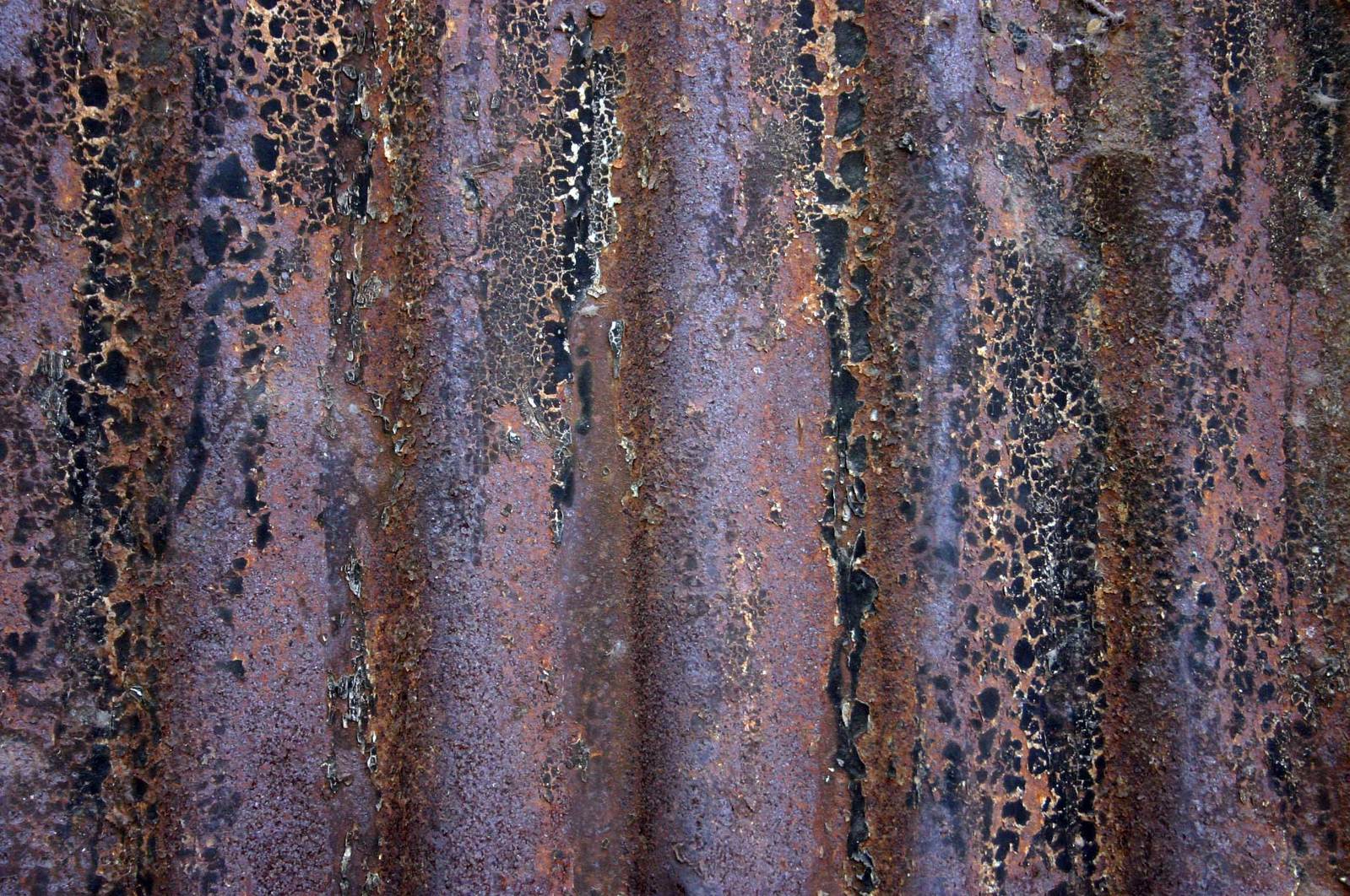 a rusted metal texture background of dark colors