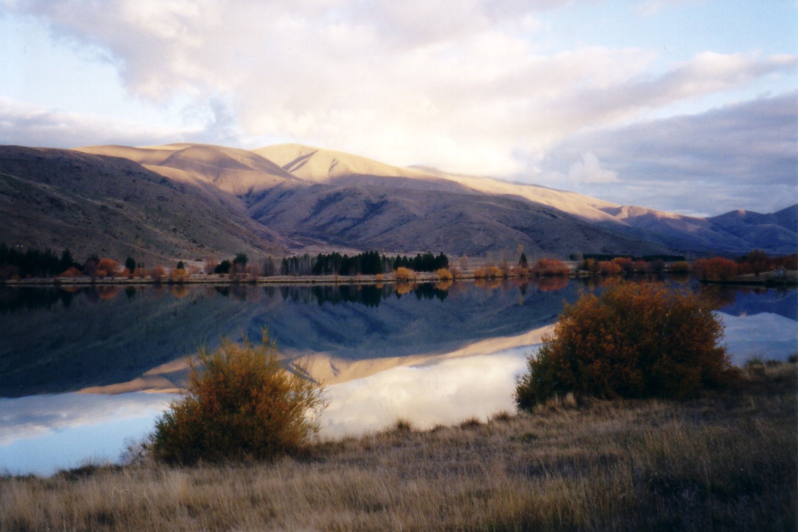 the view from the side of a mountain in autumn