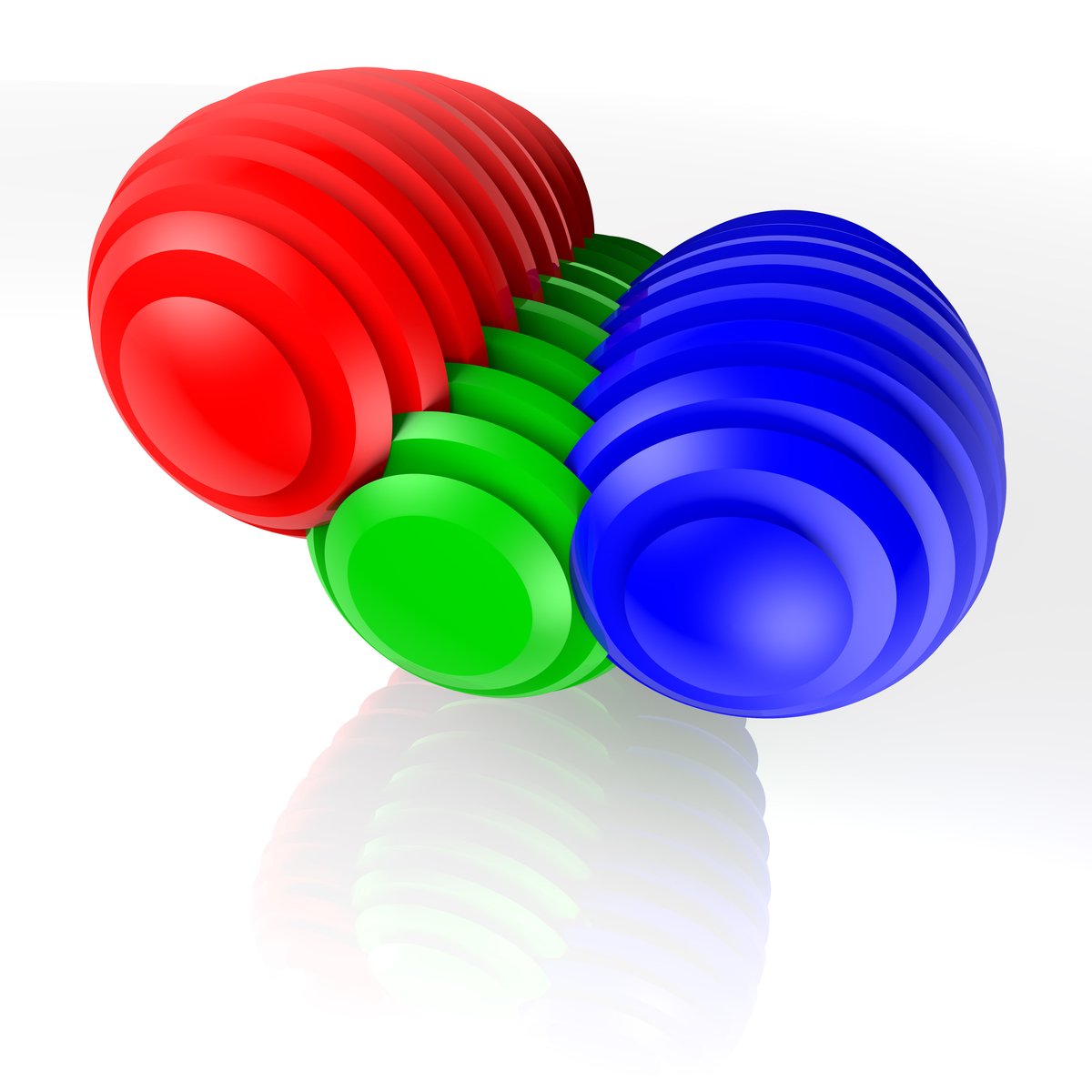 three colorful balls sitting side by side on a white background