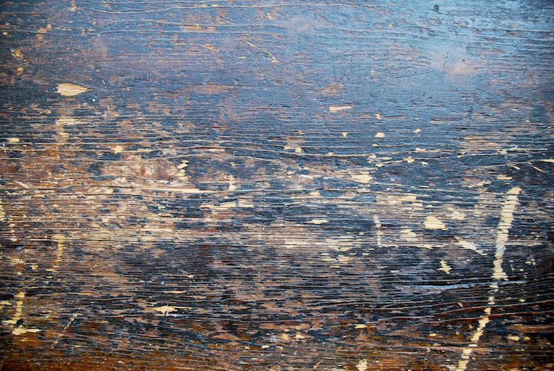 closeup of a worn and peeling wooden surface