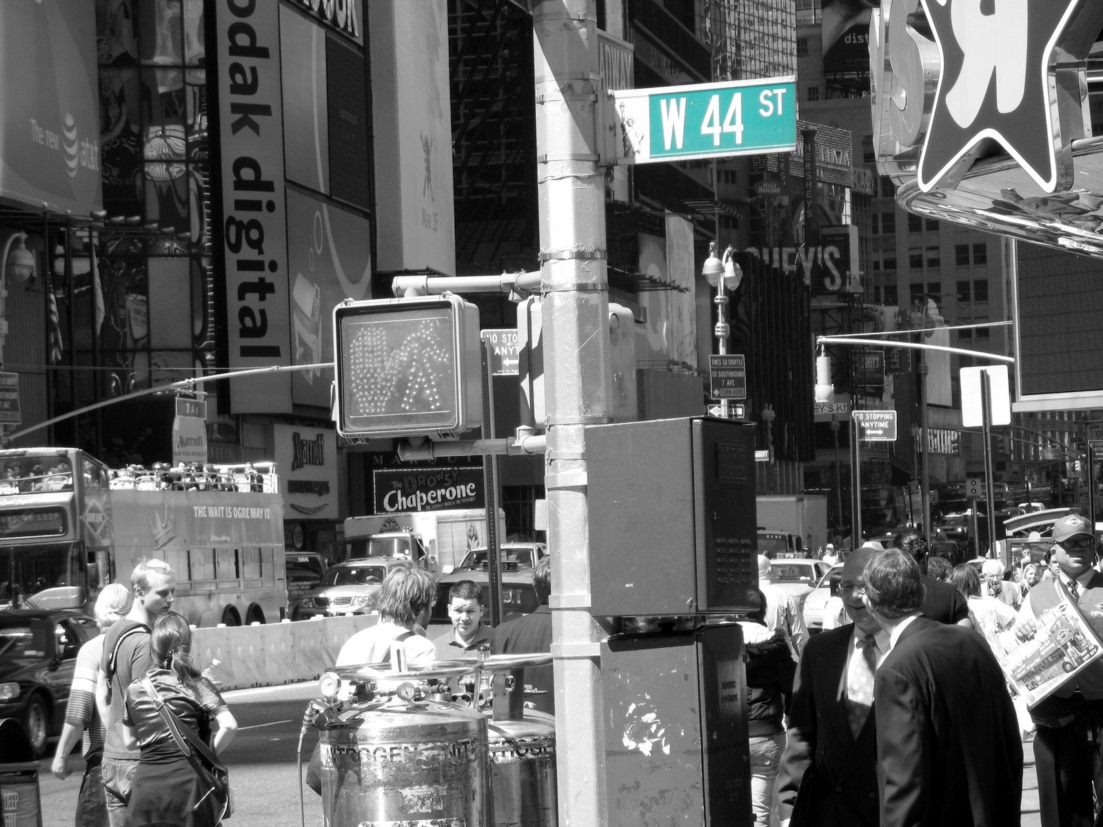 black and white po of people gathered at corner of 34th street