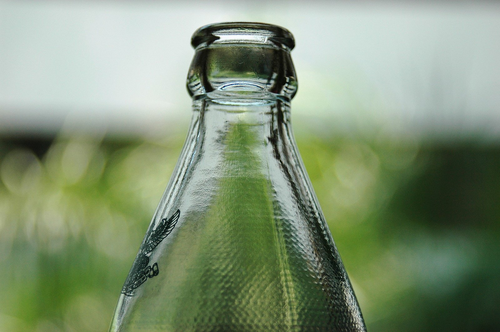 a close up of a glass bottle on a table