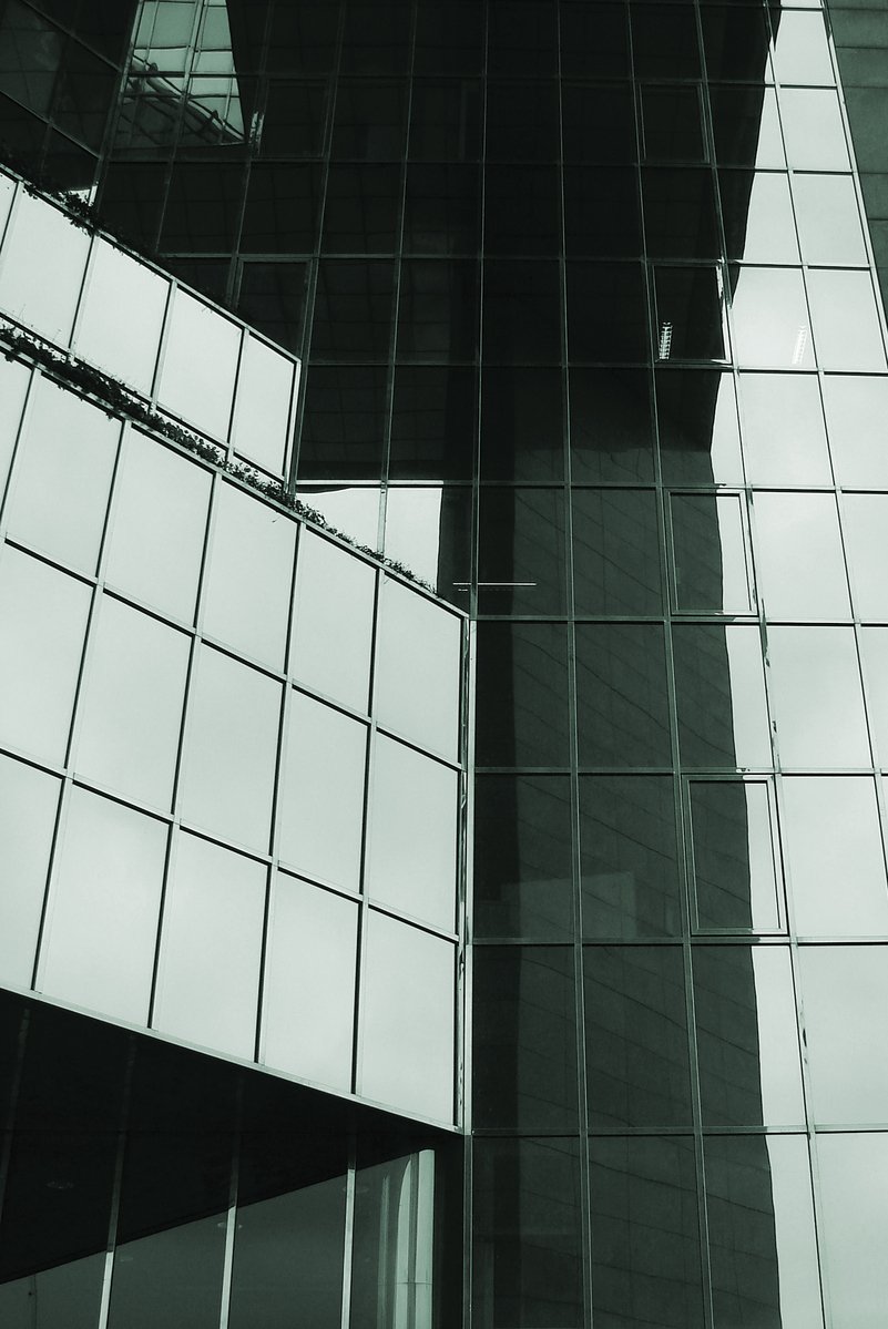 black and white pograph of the outside of a glass building