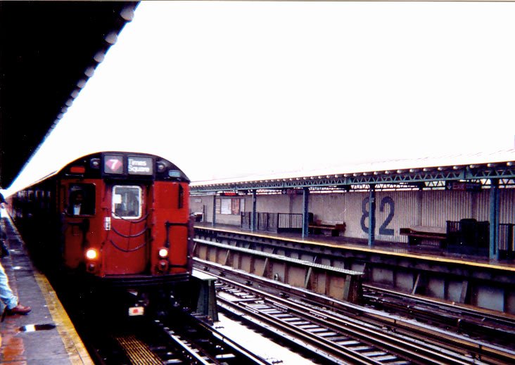 a train is at the station waiting for passengers