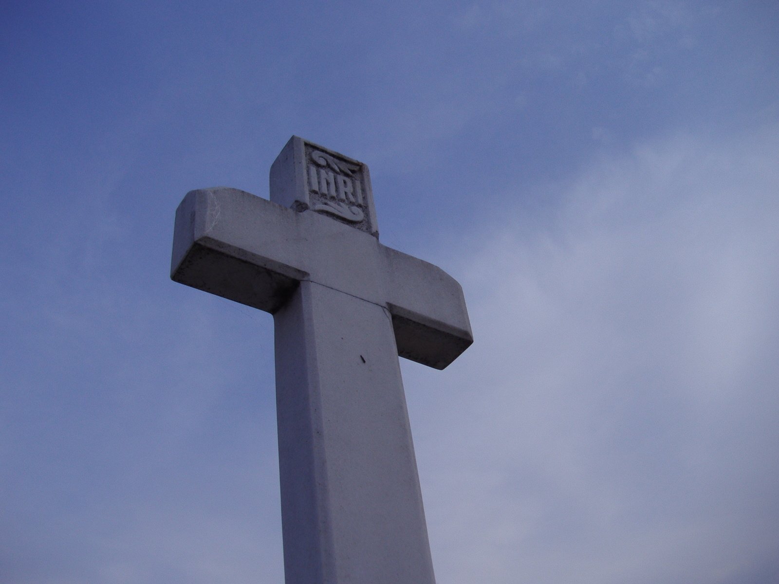 the cross of the building has a small d and r on top