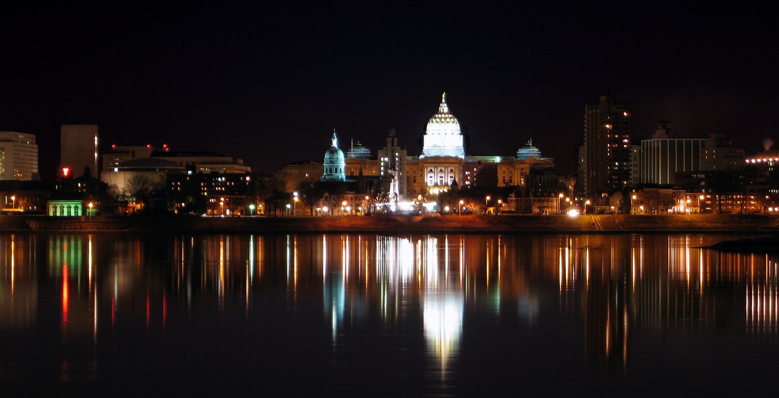 a view of a city across a large body of water at night