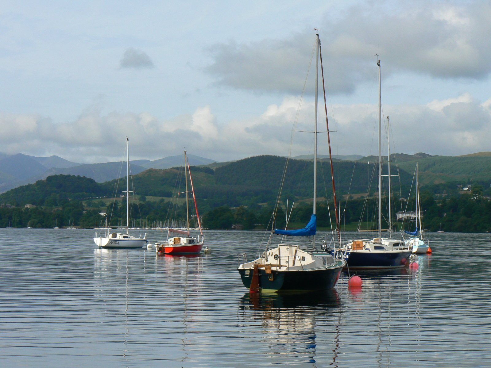 small boats in calm bay on beautiful day