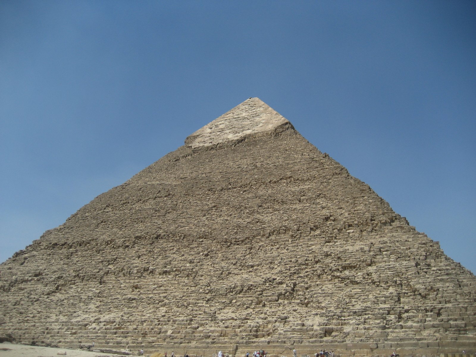 the great sphinx with some people standing in front of it